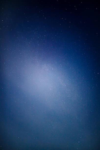 istock Night sky, stars at night, shooting star over the forest 2179901985