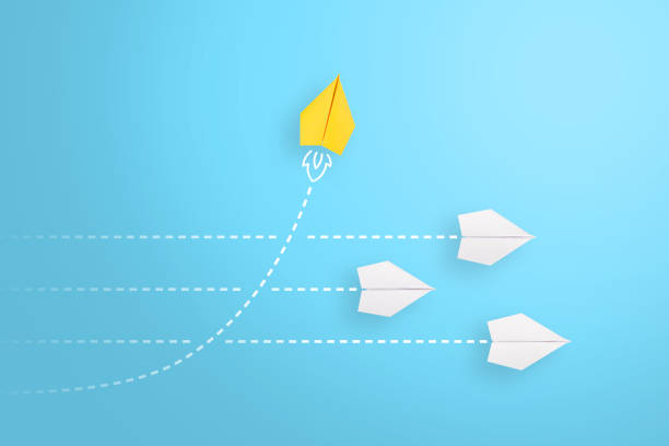 istock Change concepts with yellow paper airplane leading among white. 2179902987