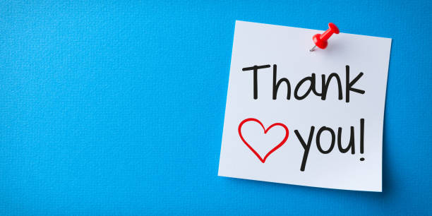 istock White Sticky Note With Thank You And Red Push Pin On Blue Cardboard. 2179903138