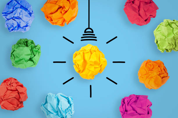 istock Innovative Idea Concepts with Light Bulb Crumpled Paper on Blue Background. 2179903323