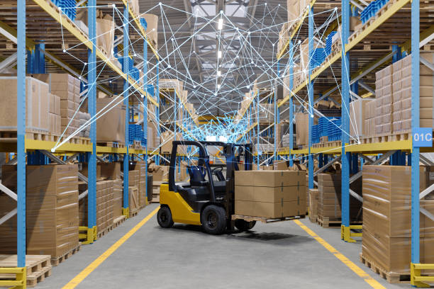 Distribution Warehouse With Forklift, Cardboard Boxes And Plexus.  Remote Control With Mobile App And Technology Devices