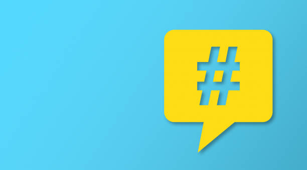 istock Hashtag and Speech Bubbles with Copy Space On Blue Cardboard Background. 2179903903