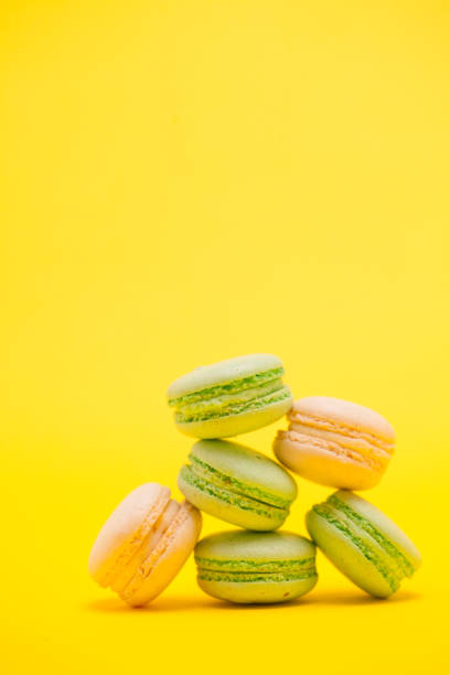 istock Delicious french macaroon biscuit over yellow background 2179907949