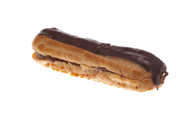 istock Delicious chocolate eclaire isolated over white background 2179908123