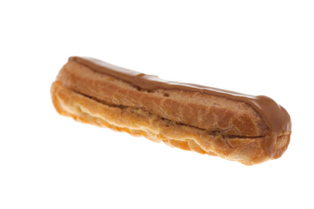 istock Sweet glazed eclaire isolated over white background 2179908439