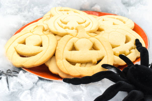 istock Plate with Halloween pumpkin-shaped cookies and a spider. 2179915027