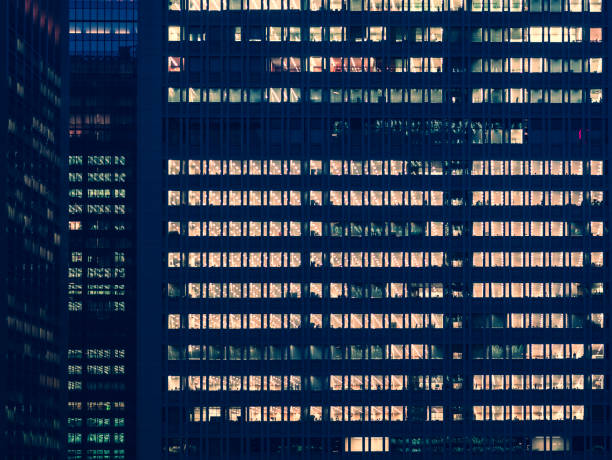istock Office building at night with lighting Modern Architecture Business background 2179915196