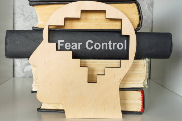 istock Books about fear control and a head model. 2179916497
