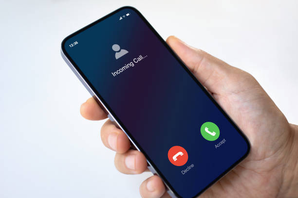 istock male hand holding phone with incoming call screen white background 2179917084