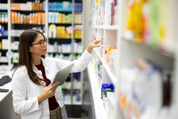 istock Female pharmacist arranging some new pharmaceutical products 2179926797