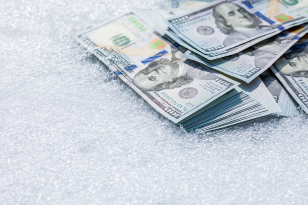 istock us dollar banknotes laid on the snow 2179926821