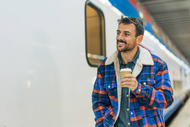 istock A mid-adult, handsome man at the  train station. 2179926856