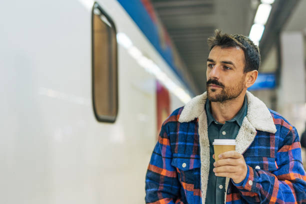 istock A mid-adult, handsome man at the  train station. 2179926932