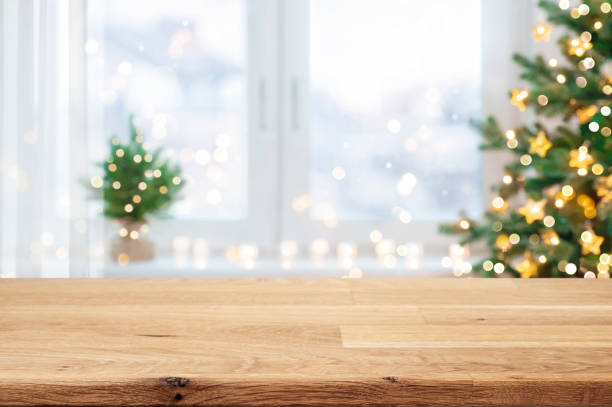 istock Wooden table for display products with blurred Christmas tree and window interior background 2179928791