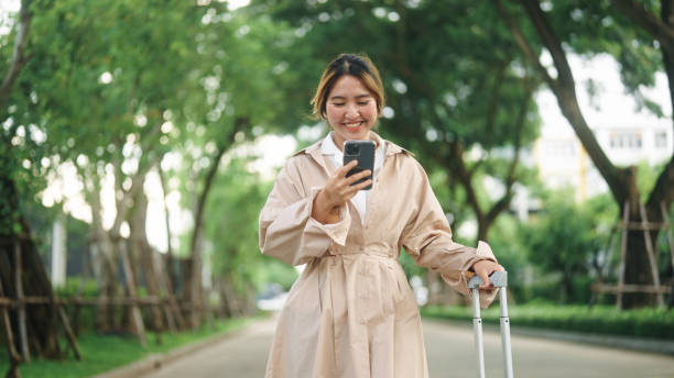 istock Businesswoman using smartphone while travel. 2179929784