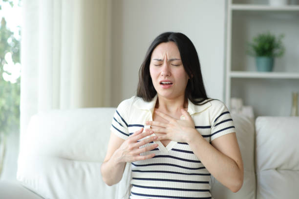 istock Asian woman chocking suffering asthma attack at home 2179930150