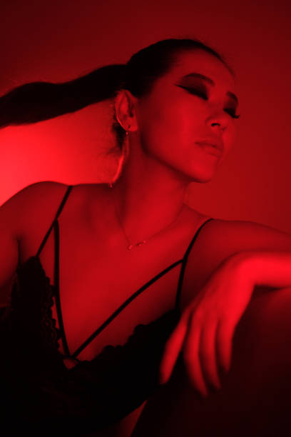 istock Young Woman in Red Neon Lights 2179931101