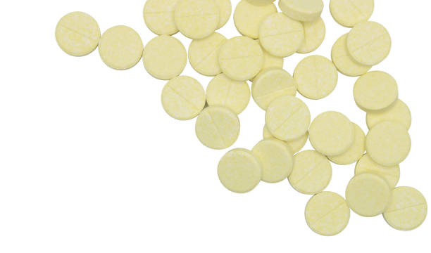 istock Top view. Yellow vitamin C tablets on isolated background. 2179934014