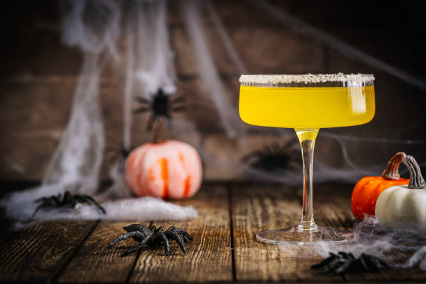 istock Halloween-Themed Cocktail with Pumpkins and Spider Decoration 2179939752
