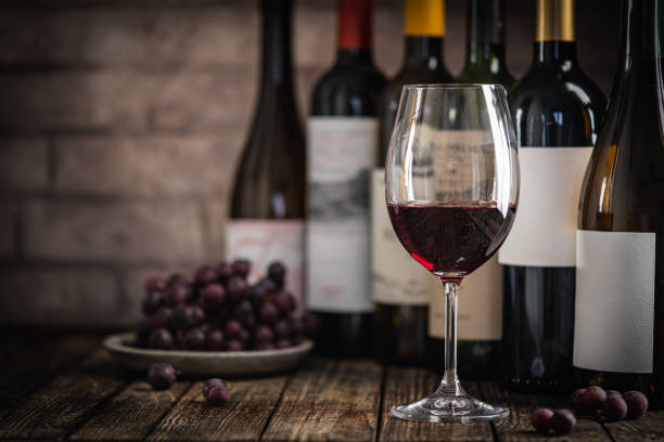 istock Red Wine in a Glass with Bottles and Grapes 2179939867