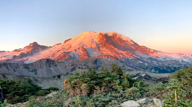 istock Mount Rainier towers over the surrounding mountains 2179944896