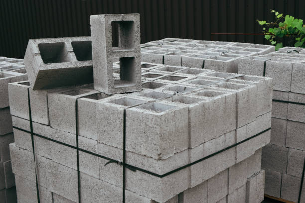 istock Hollow concrete wall blocks assembled on pallets. Construction concrete block. Vibration-pressed building block. 2179947094