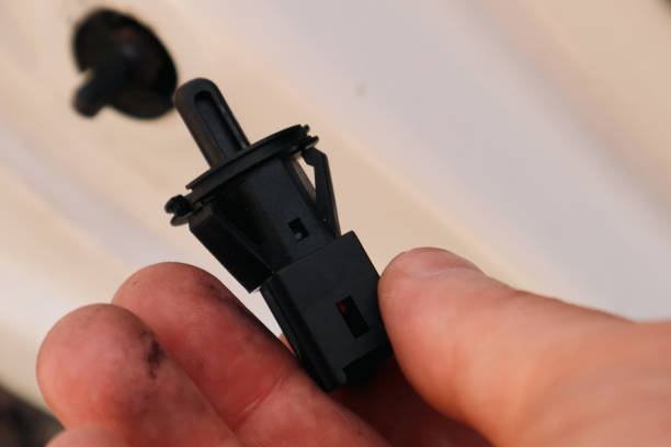 istock Car door limit switch in hand. Auto parts. 2179947269