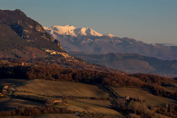 Misty Winter Landscape with Snowy Mountains and Valley View