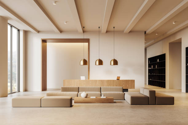 istock Stylish lobby interior with sofa and reception desk in office room, window 2179955754