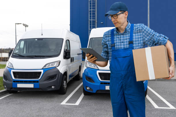 istock Delivery man in uniform with digital tablet. 2179959753