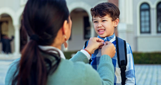 istock Mother, boy and education with backpack, excited and help with school, new day and knowledge. Outdoor, family and single parent with kid, childhood and mama with student, learning and support 2179961226