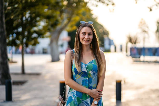 istock Young Woman Standing In The Park 2179962175