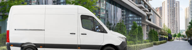istock White delivery van on city street. 2179964033