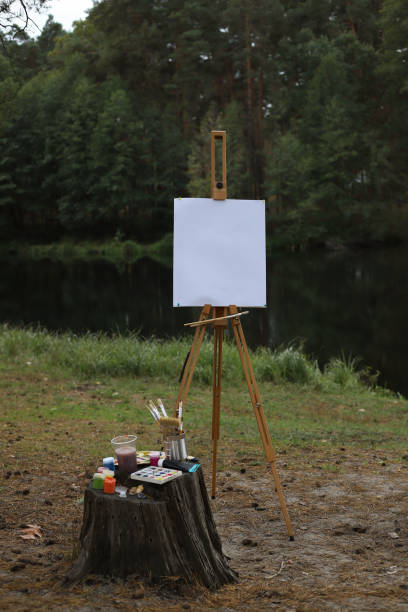 istock wooden easel with a blank white canvas 2179965278