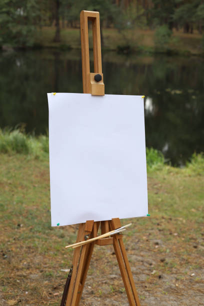 istock wooden easel with a blank white canvas 2179965281