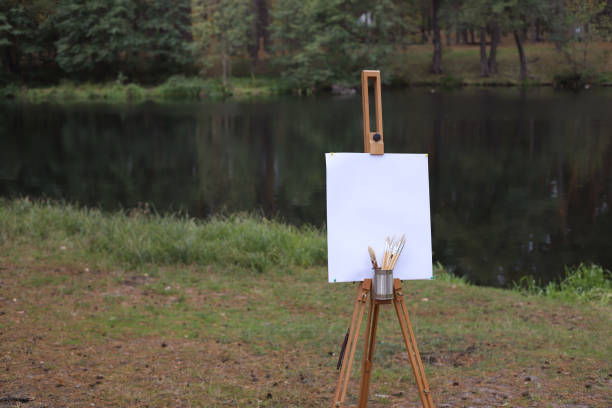 istock wooden easel with a blank white canvas 2179965295