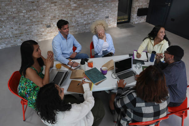 istock People sitting around table during business meeting 2179966900