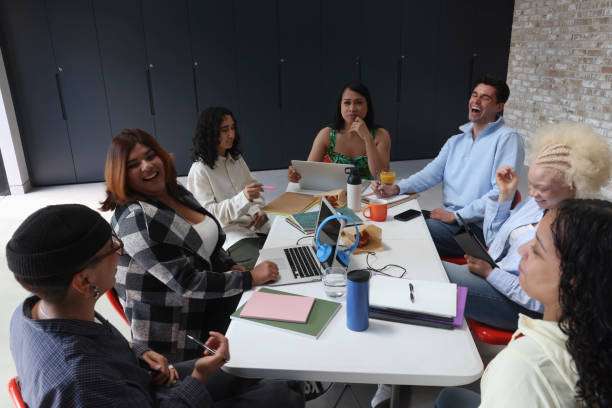 istock People sitting around table during business meeting 2179966910