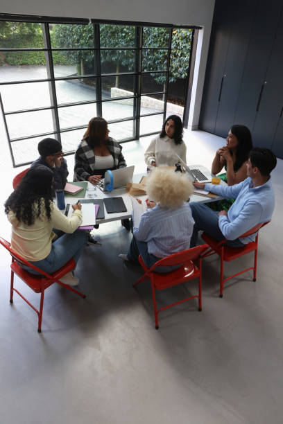 istock People sitting around table during business meeting 2179966931