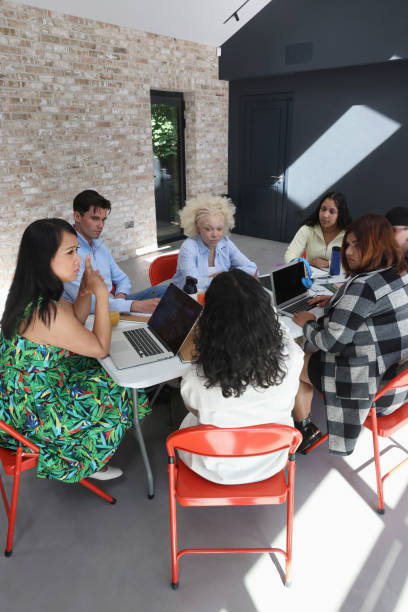 istock People sitting around table during business meeting 2179966986