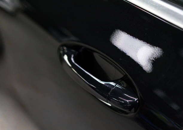 Close-up of a sleek car door handle showcasing a modern design  and polyurethane film protection