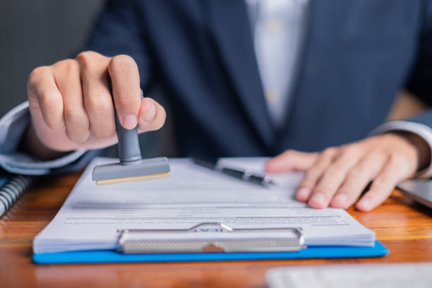 istock Man carefully reviewed finance agreements and contract documents with his client, discussing loan, mortgage, investment opportunities, credit terms, and tax implications for their business. 2179969832