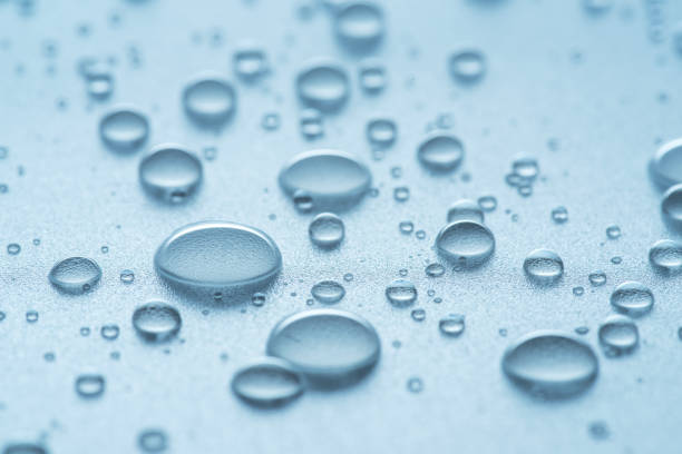 istock Water drops or condensation drops on surface, macro shot. Water drops background as a symbol of freshness and purity. 2179970510