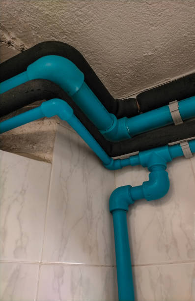istock various PVC pipes with blue elbows, joints, etc. installed in a downspout 2179971332