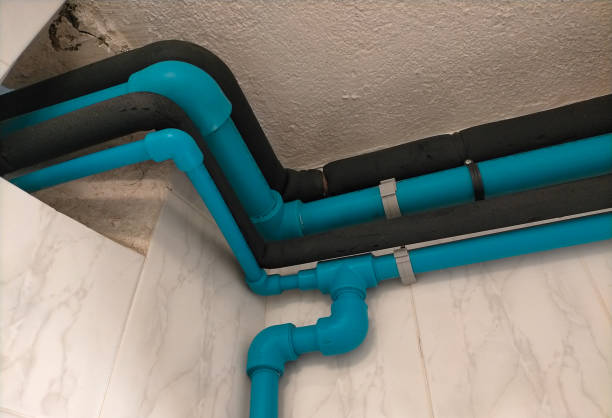 istock various PVC pipes with blue elbows, joints, etc. installed in a downspout 2179971337