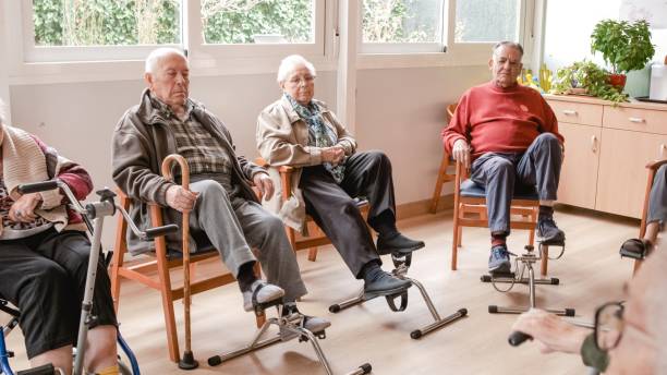 istock Senior people doing pedal exercises at rehabilitation center 2179972009