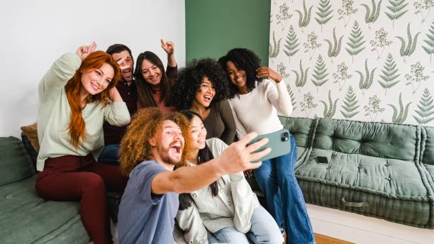istock Happy diverse friends taking self-portraits at home 2179974035