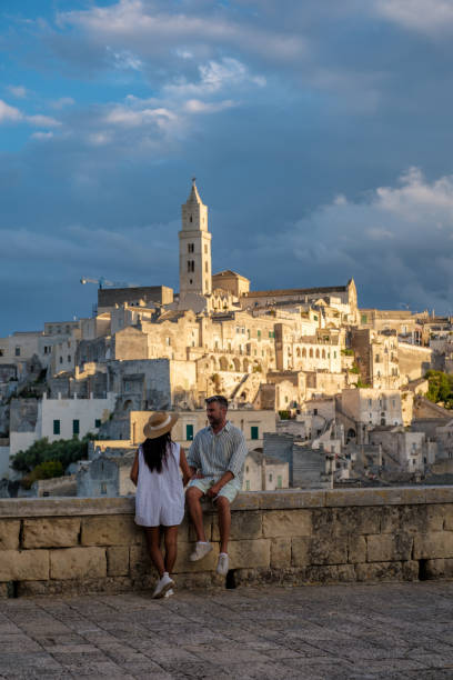 istock Couple enjoying sunset views in Matera, Puglia while exploring ancient stone buildings 2179978031