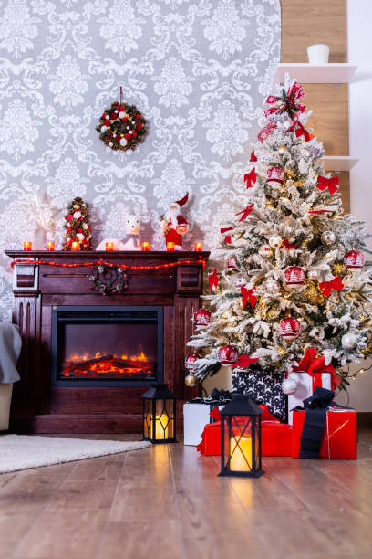 istock Colorful presents under Christmas tree in decorated room 2179978794