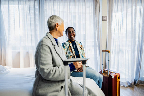 istock Female senior friends talking in a hotel 2179985028